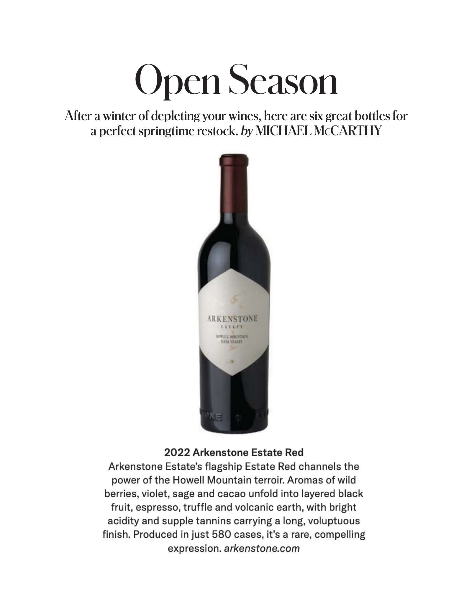 A bottle of Arkenstone Estate Red wine is centered on a white background. Above it, text reads “Open Season,” introducing a spring wine restock. Below, a paragraph describes the wine’s flavors and qualities.
