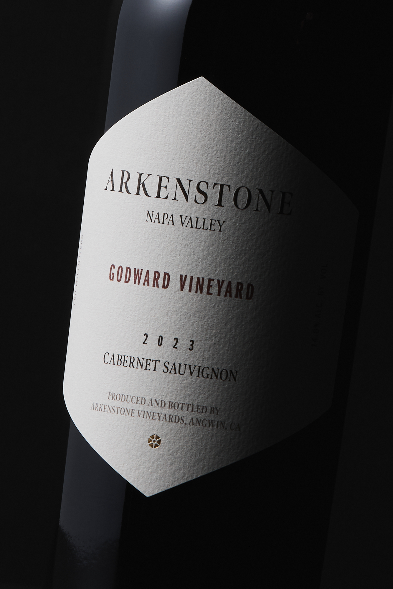 A close-up of a wine bottle label reading 2023 Godward Vineyard Cabernet Sauvignon against a dark background.